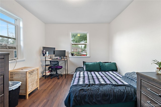 8820 Poze Blvd, Thornton, CO 80229 - bedroom with multiple windows, dark wood finished floors, and cooling unit