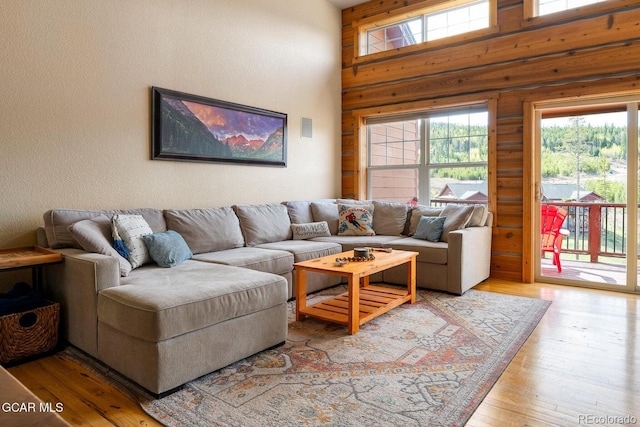 220 Reunion Ct, Fraser, CO 80442 - living area with light wood finished floors, a high ceiling, and wood walls