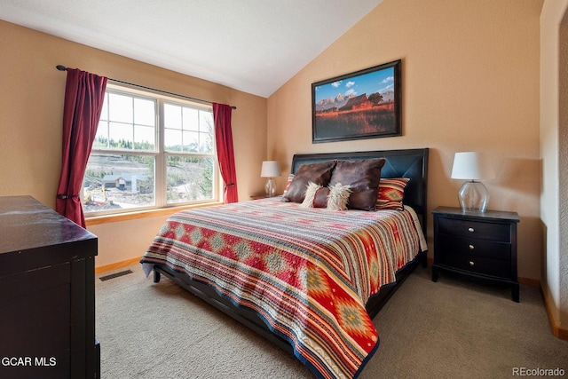 220 Reunion Ct, Fraser, CO 80442 - carpeted bedroom featuring vaulted ceiling and baseboards