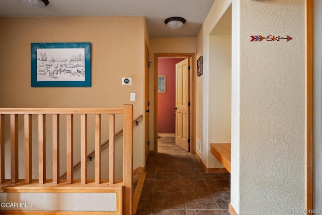 220 Reunion Ct, Fraser, CO 80442 - corridor with an upstairs landing and dark tile patterned floors