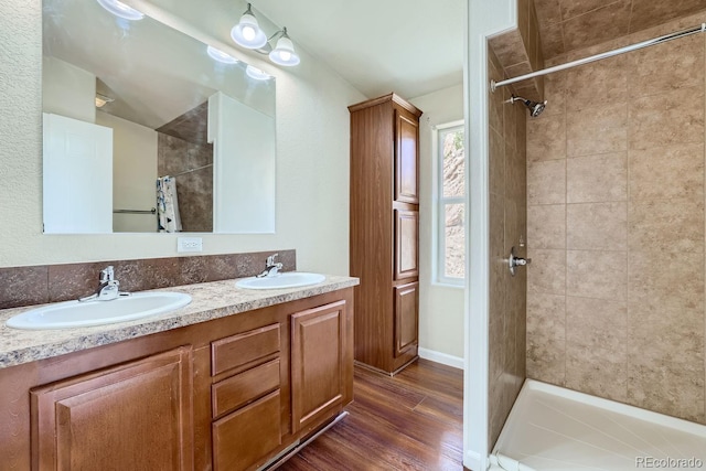 bathroom with hardwood / wood-style floors, vanity, and a shower with curtain