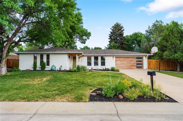 6643 W Roxbury Pl, Littleton, CO 80128 - view of front of home featuring driveway, an attached garage, and stucco siding