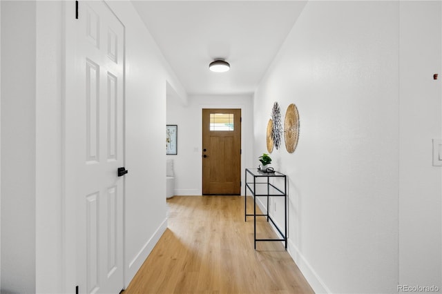 6643 W Roxbury Pl, Littleton, CO 80128 - foyer entrance with light wood finished floors and baseboards