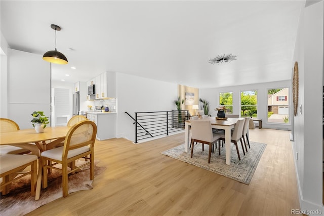 6643 W Roxbury Pl, Littleton, CO 80128 - dining room with light wood finished floors and recessed lighting