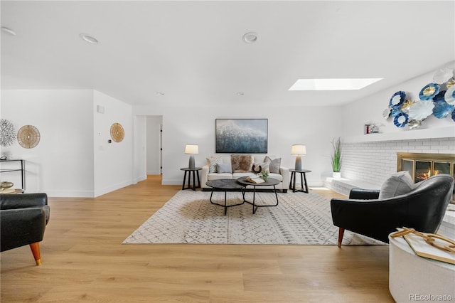 6643 W Roxbury Pl, Littleton, CO 80128 - living room with a skylight, wood finished floors, and a fireplace