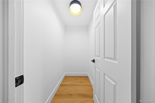 6643 W Roxbury Pl, Littleton, CO 80128 - hallway with baseboards and light wood finished floors