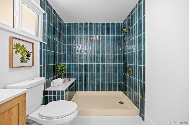 6643 W Roxbury Pl, Littleton, CO 80128 - bathroom featuring a tile shower, vanity, and tile patterned flooring