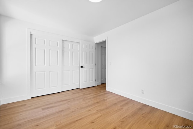 6643 W Roxbury Pl, Littleton, CO 80128 - unfurnished bedroom with light wood-type flooring and a closet