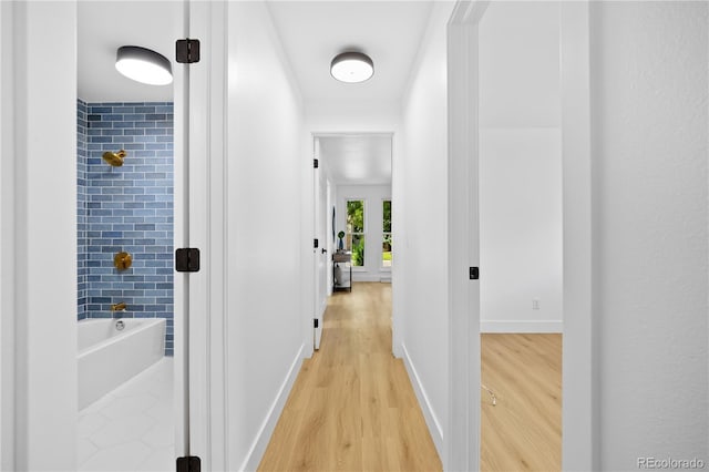 6643 W Roxbury Pl, Littleton, CO 80128 - hallway with light wood-type flooring and baseboards