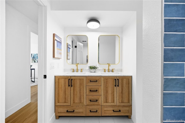 6643 W Roxbury Pl, Littleton, CO 80128 - full bathroom with double vanity and wood finished floors