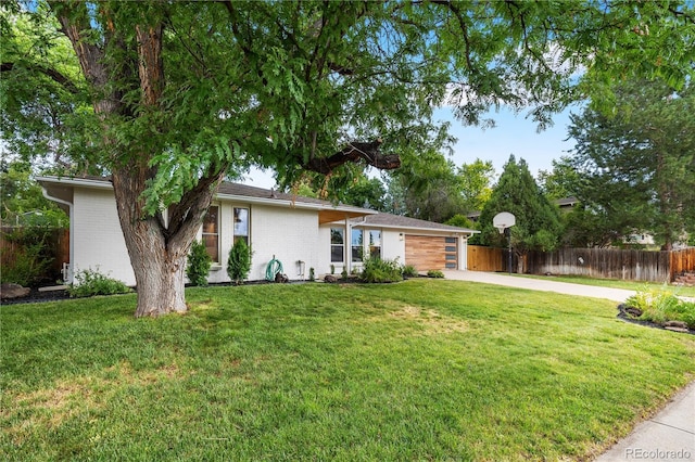 6643 W Roxbury Pl, Littleton, CO 80128 - view of front of house with concrete driveway, an attached garage, and brick siding