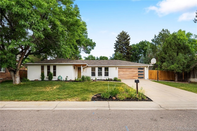 6643 W Roxbury Pl, Littleton, CO 80128 - view of front of property with driveway, a garage, and stucco siding