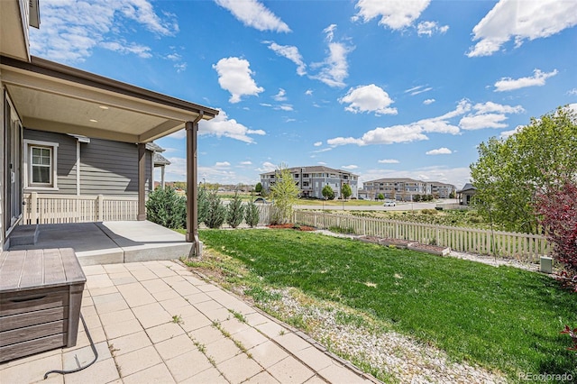 view of yard featuring a patio area and a fenced backyard