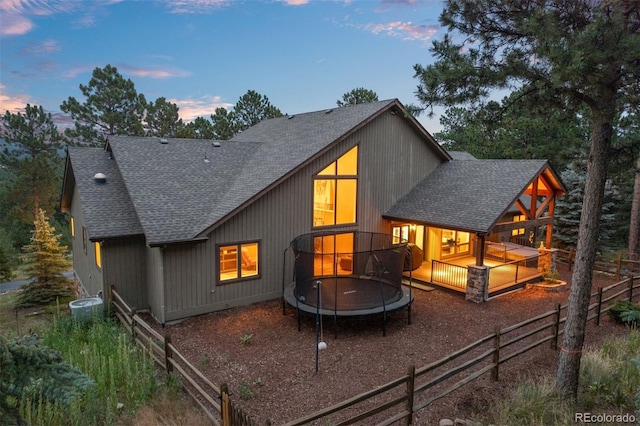 29210 Northstar Ln, Evergreen, CO 80439 - rear view of property with roof with shingles and a trampoline