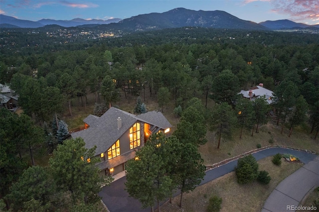 29210 Northstar Ln, Evergreen, CO 80439 - aerial view at dusk of a wooded view and a mountain view