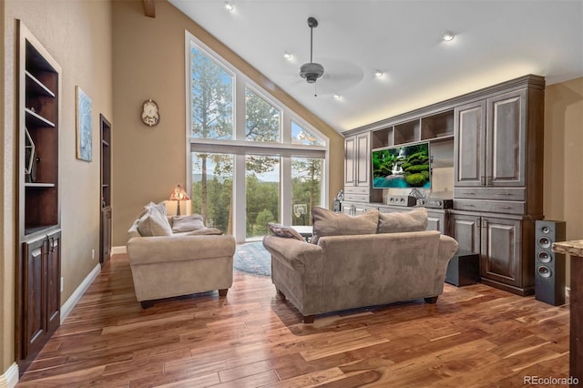 29210 Northstar Ln, Evergreen, CO 80439 - living room with wood finished floors, ceiling fan, high vaulted ceiling, and recessed lighting