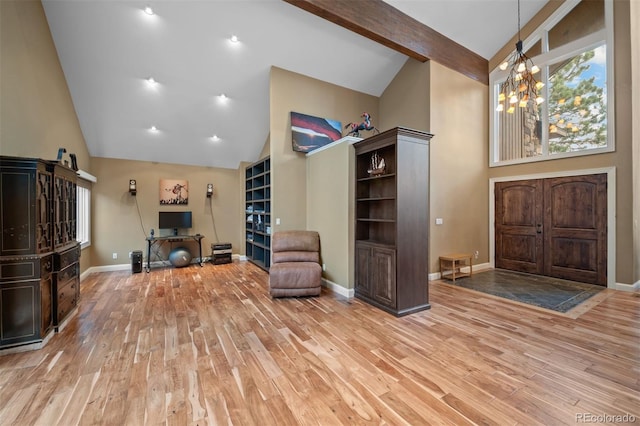 29210 Northstar Ln, Evergreen, CO 80439 - foyer entrance featuring high vaulted ceiling, wood finished floors, a chandelier, and beamed ceiling