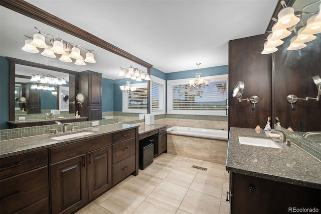 29210 Northstar Ln, Evergreen, CO 80439 - bathroom with a chandelier, a garden tub, two vanities, and tile patterned flooring