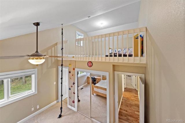 29210 Northstar Ln, Evergreen, CO 80439 - stairway featuring carpet flooring and high vaulted ceiling