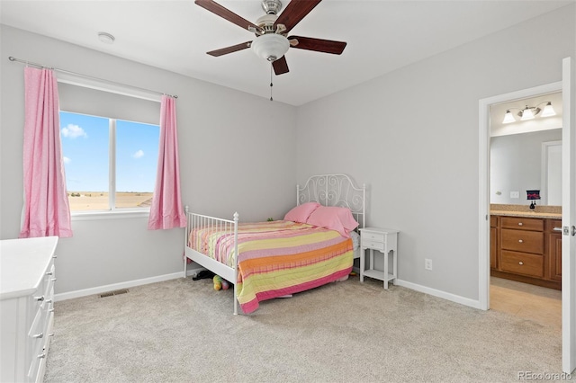 11343 E 163rd Ct, Brighton, CO 80602 - bedroom with light colored carpet, baseboards, ensuite bathroom, and ceiling fan