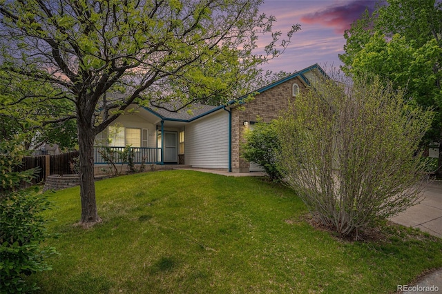 5214 S Tibet St, Aurora, CO 80015 - view of front of property with brick siding and covered porch