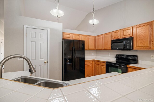 5214 S Tibet St, Aurora, CO 80015 - kitchen featuring black appliances, a sink, tile countertops, lofted ceiling, and decorative light fixtures