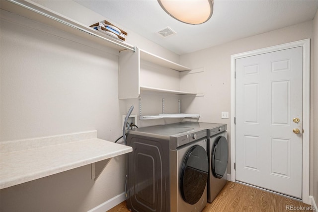 5214 S Tibet St, Aurora, CO 80015 - laundry room featuring independent washer and dryer, light wood finished floors, and baseboards