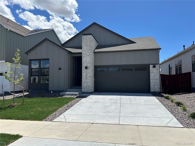1613 Winter Glow Dr, Windsor, CO 80550 - modern farmhouse style home featuring board and batten siding, a shingled roof, a garage, and driveway