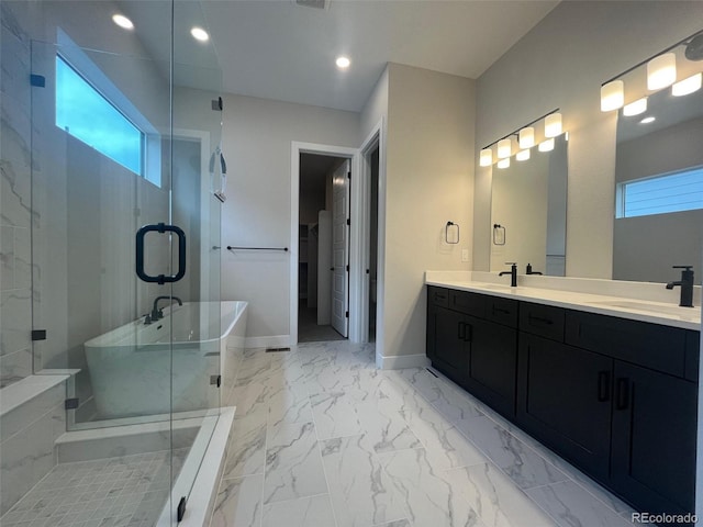 1613 Winter Glow Dr, Windsor, CO 80550 - full bathroom with double vanity, a freestanding bath, marble look tiles, a stall shower, and recessed lighting