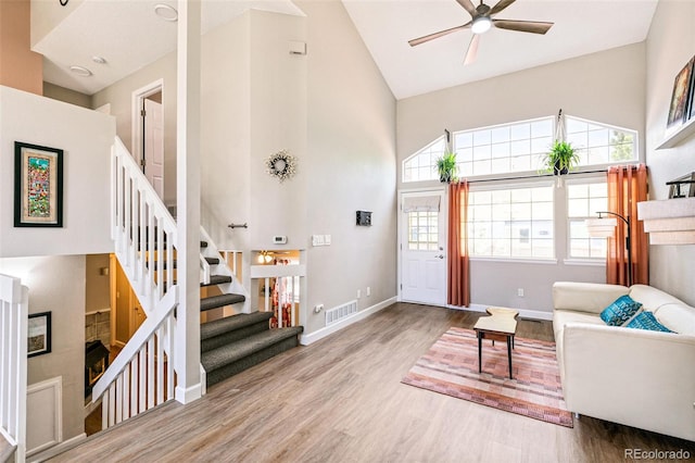 3612 Rosewalk Cir, Highlands Ranch, CO 80129 - entrance foyer with high vaulted ceiling, a ceiling fan, wood finished floors, and stairs