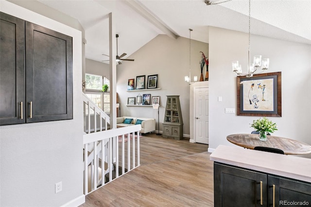 3612 Rosewalk Cir, Highlands Ranch, CO 80129 - corridor featuring light wood-style floors, a chandelier, beam ceiling, and high vaulted ceiling