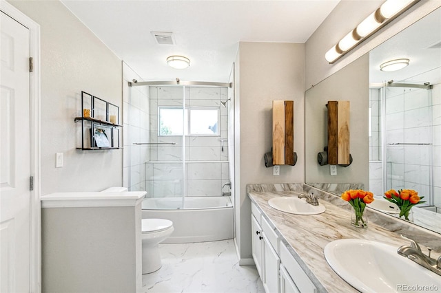 3612 Rosewalk Cir, Highlands Ranch, CO 80129 - full bath with marble finish floors, double vanity, and combined bath / shower with glass door
