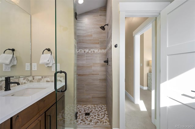 bathroom with a stall shower and vanity