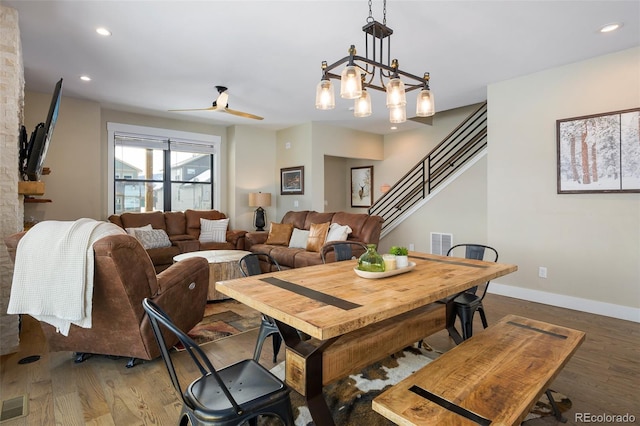 dining space featuring recessed lighting, wood finished floors, visible vents, baseboards, and stairs