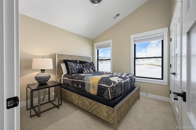 bedroom featuring light carpet, baseboards, visible vents, and vaulted ceiling