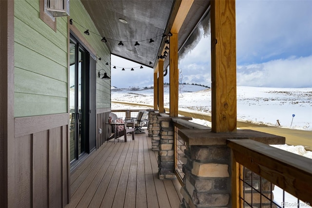 view of snow covered deck