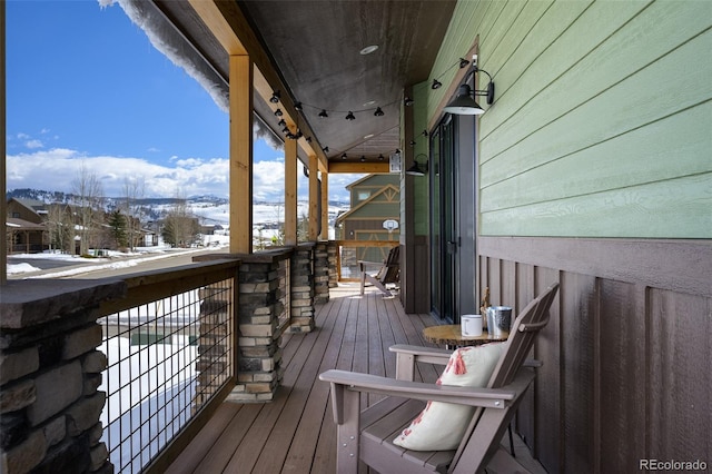 view of snow covered deck