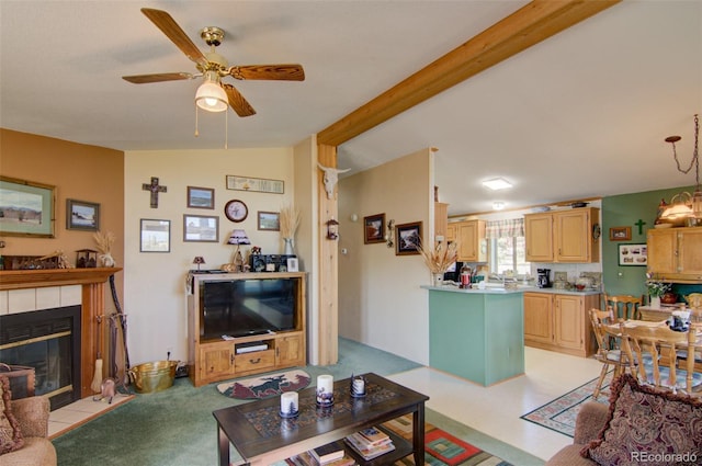 91 Canteen Way, Hartsel, CO 80449 - living area with ceiling fan, a tiled fireplace, and vaulted ceiling