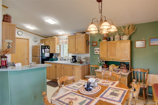 91 Canteen Way, Hartsel, CO 80449 - kitchen with freestanding refrigerator, vaulted ceiling, light brown cabinets, light countertops, and ornamental molding