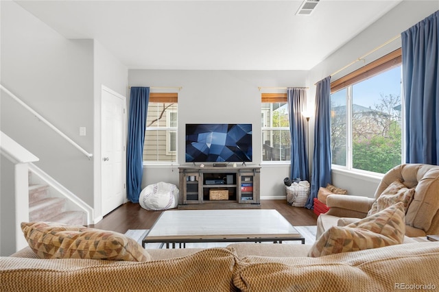 12973 Grant Cir E Unit A, Thornton, CO 80241 - living room with wood finished floors, stairway, and baseboards