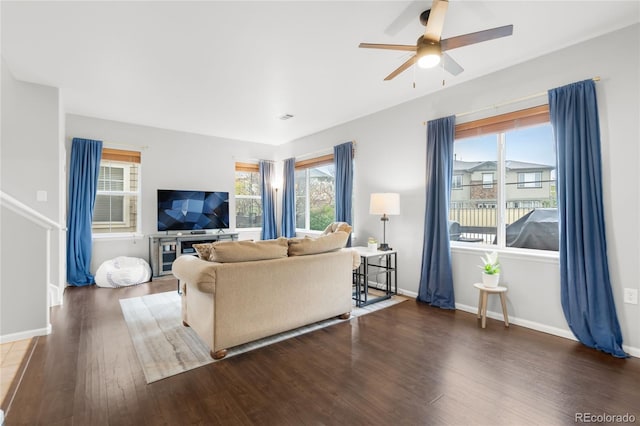 12973 Grant Cir E Unit A, Thornton, CO 80241 - living room featuring wood finished floors, ceiling fan, and baseboards