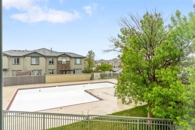 12973 Grant Cir E Unit A, Thornton, CO 80241 - exterior space with fence and a residential view