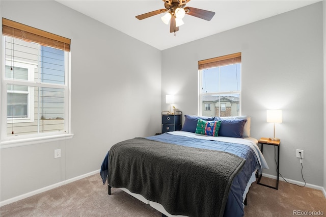 12973 Grant Cir E Unit A, Thornton, CO 80241 - carpeted bedroom with baseboards and a ceiling fan