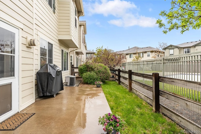12973 Grant Cir E Unit A, Thornton, CO 80241 - view of yard featuring central air condition unit, a patio, and a residential view