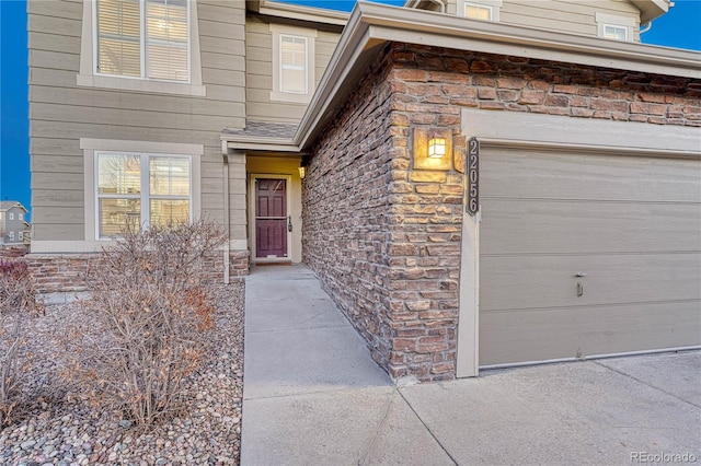 entrance to property featuring stone siding