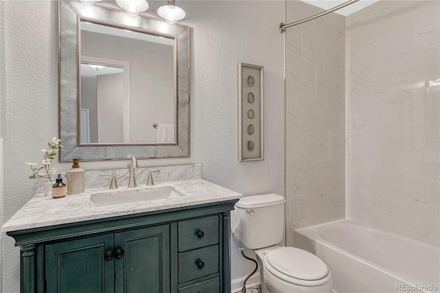 full bathroom with toilet, a textured wall,  shower combination, and vanity