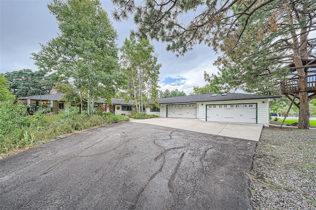 single story home with a garage