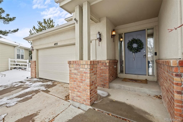 doorway to property featuring a garage