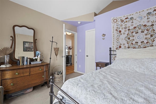 bedroom featuring carpet flooring and lofted ceiling