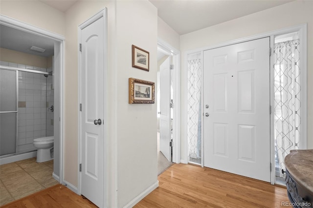 entrance foyer with light wood-type flooring